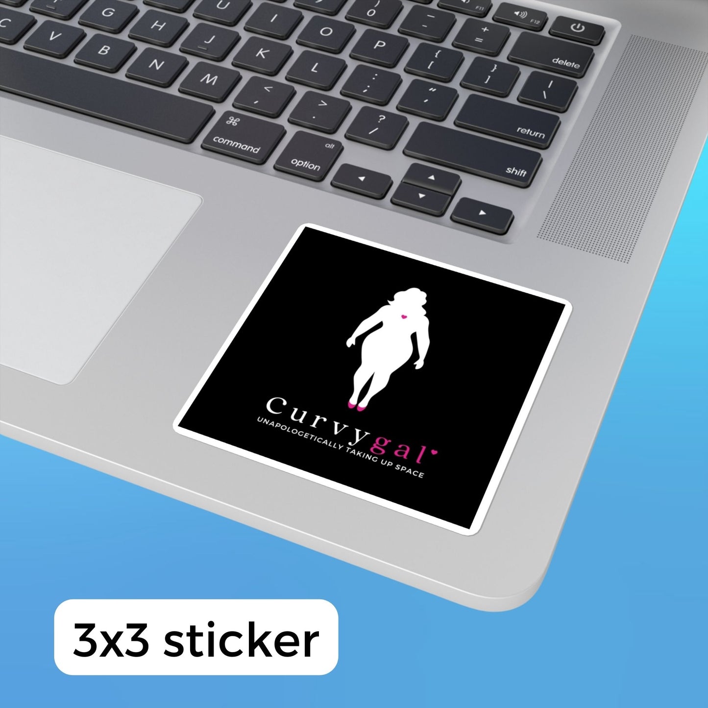 A black vinyl sticker on a laptop that reads Curvygal: Unapologetically Taking Up Space in black and pink font underneath the silhouette of a curvy feminine body with a pink heart in the center of the chest.