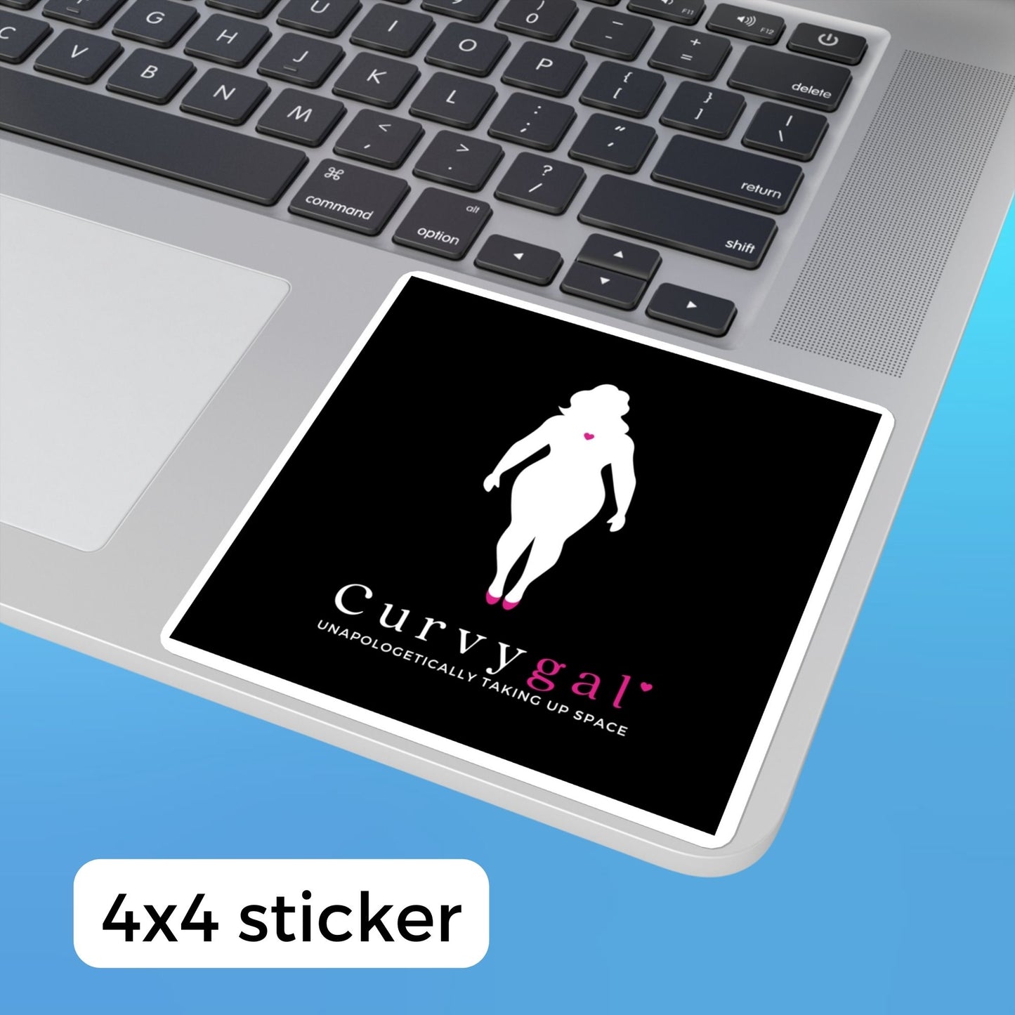 A black vinyl sticker on a laptop that reads Curvygal: Unapologetically Taking Up Space in black and pink font underneath the silhouette of a curvy feminine body with a pink heart in the center of the chest.