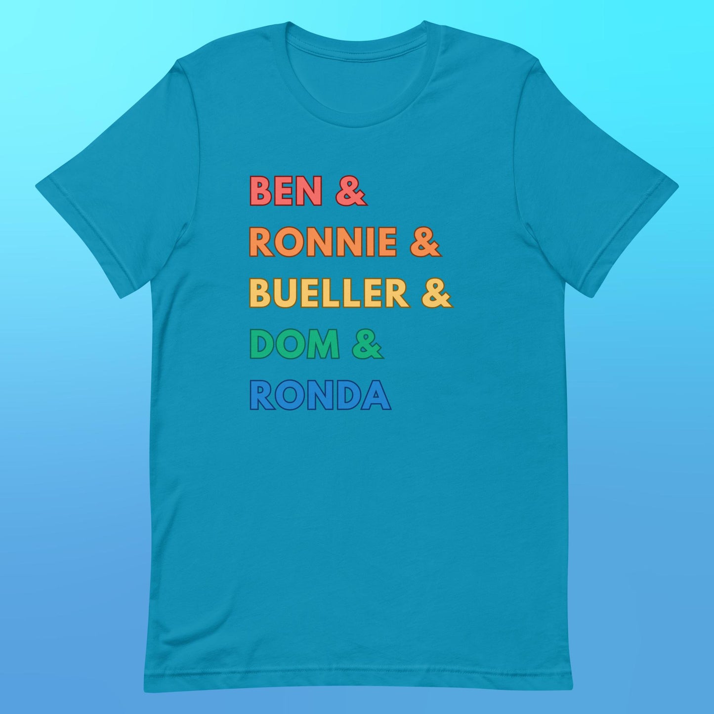 A blue t-shirt with "Ben & Ronnie & Bueller & Dom & Ronda" in capital letters and font in rainbow colors